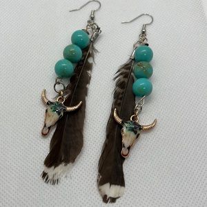 Original multicolored steer skull earrings with vintage beads and feathers.